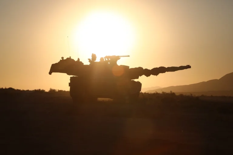 tank, sun in background